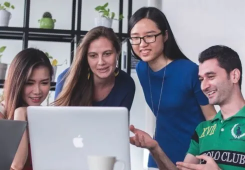 Colleagues working together on a laptop